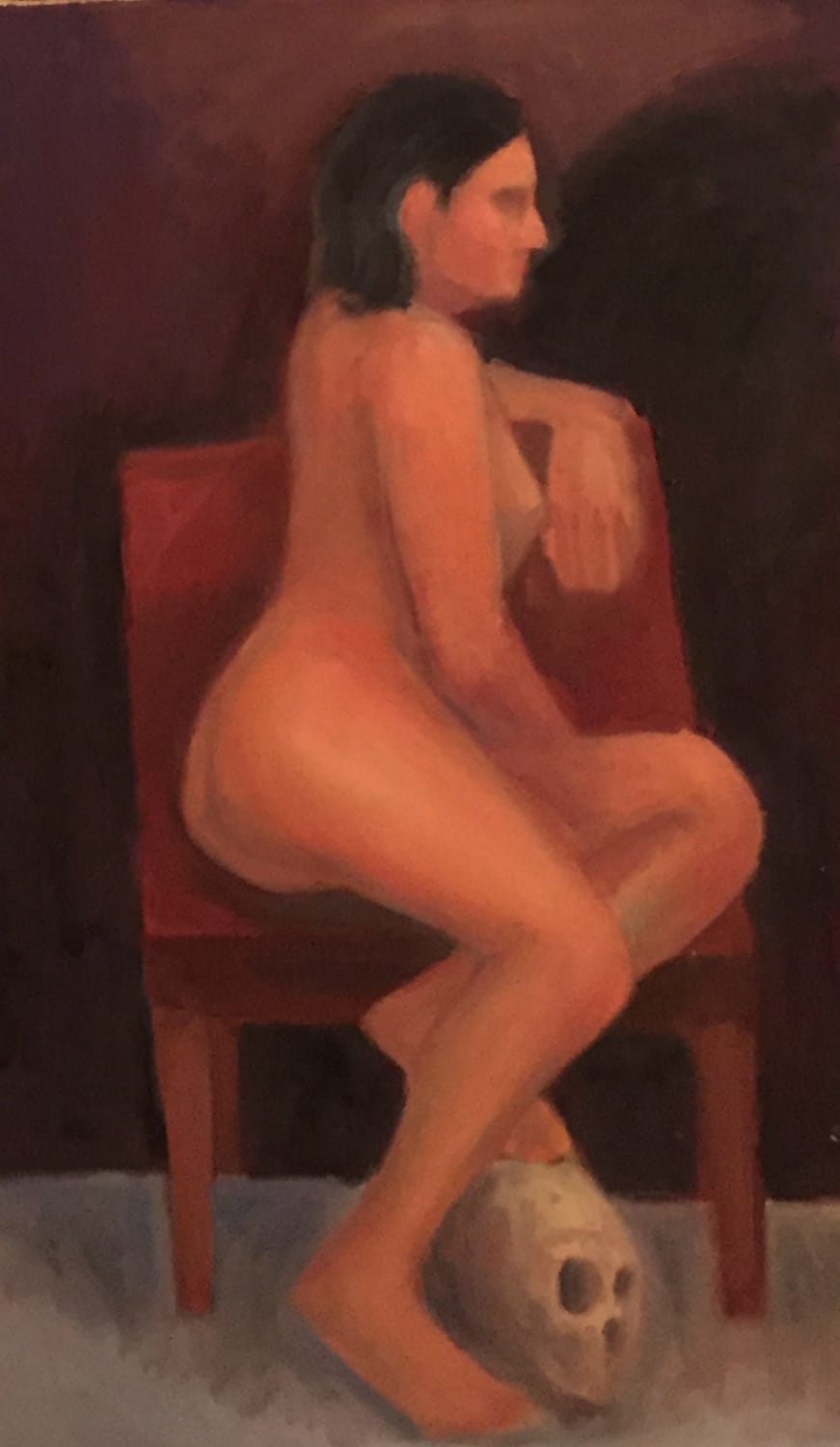 nude woman model seated seen in profile leaning away from viewer